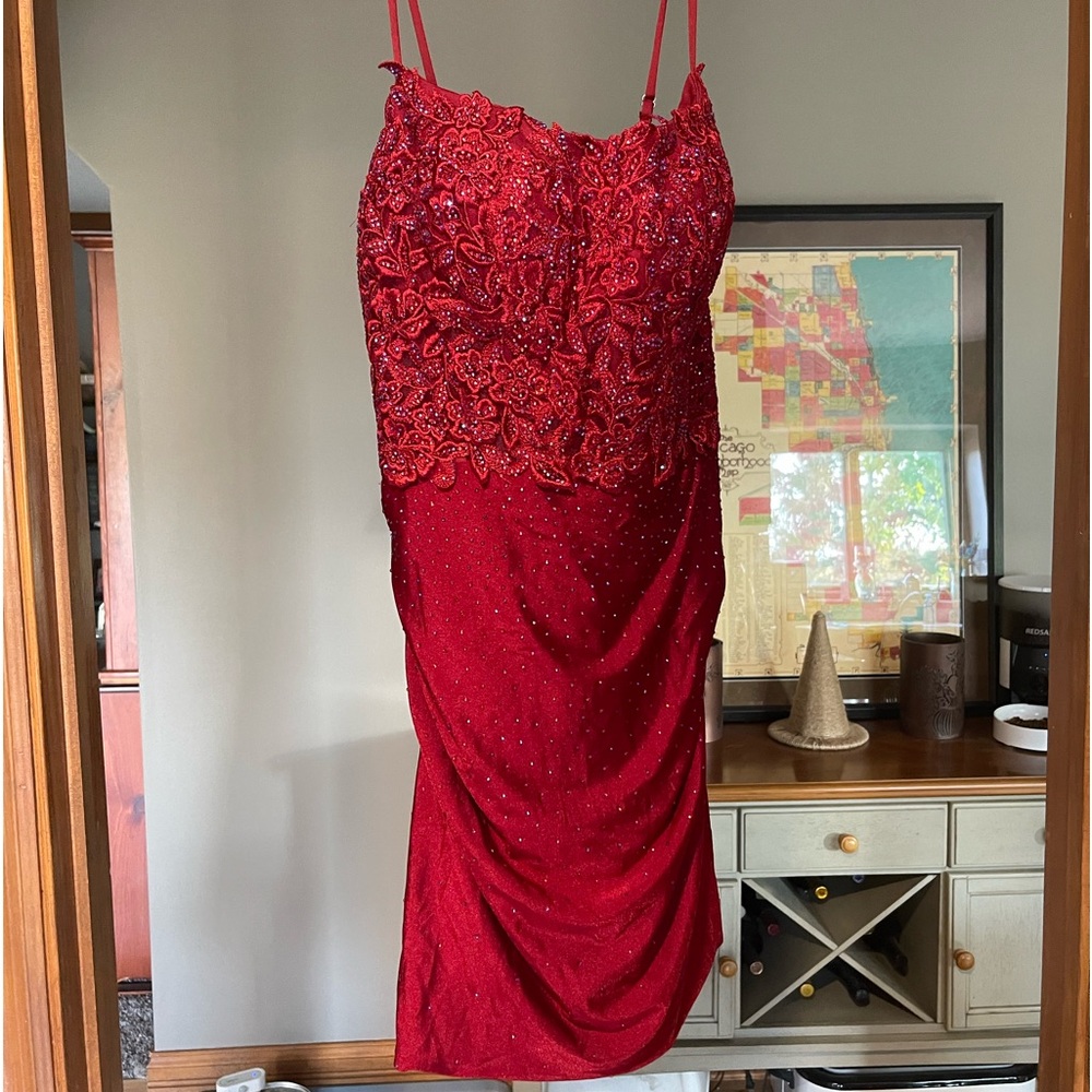 Beautiful reddish/burgundy dress size 12.  Great for HOCO or formals.